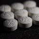 Above, pills containing a combination of the opioid oxycodone with acetaminophen, commonly sold as the brand name drug Percocet.